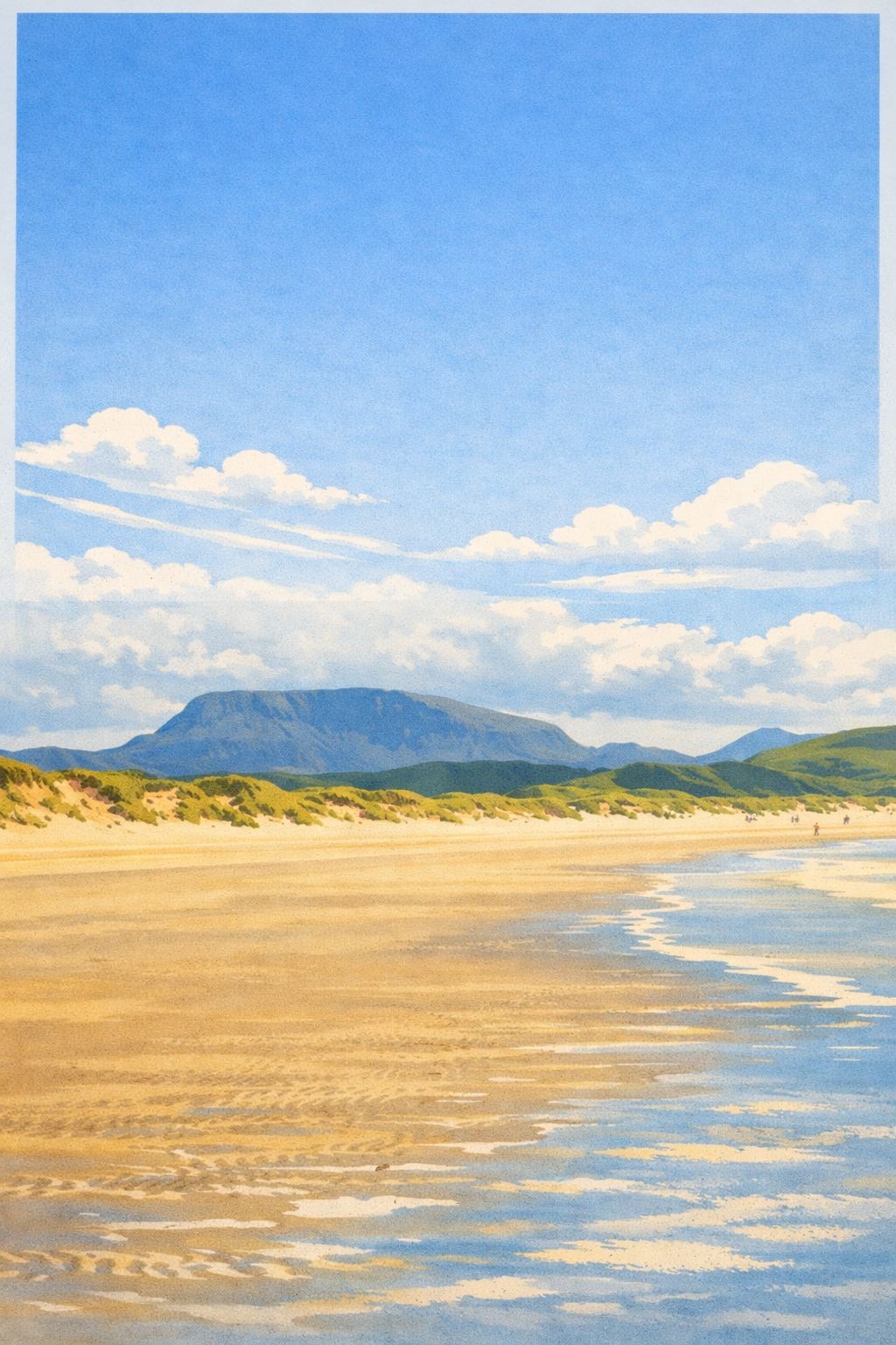 Wide sandy beach beneath distant mountains